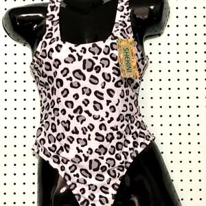 Size M Shekini one piece black and white animal print‎ swimsuit